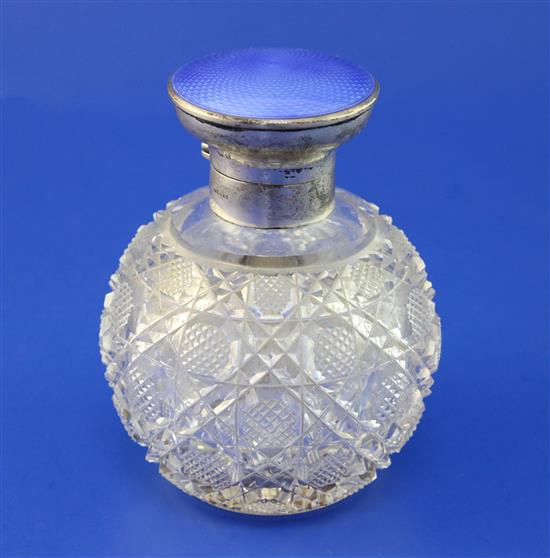 A George V silver and guilloche enamel lidded hobnail cut glass scent bottle, 5in.